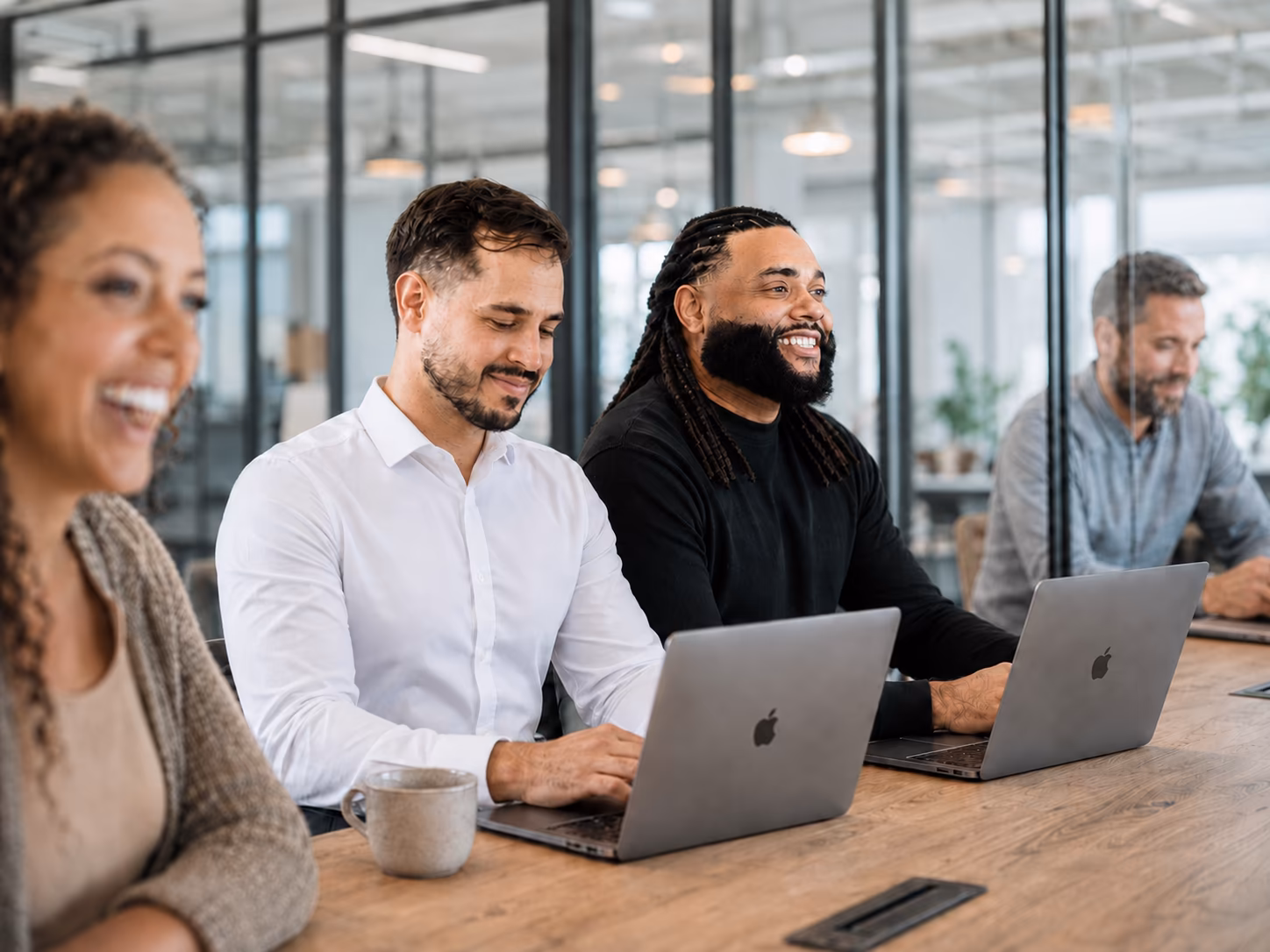 Taurist team members working together with colleagues in an office